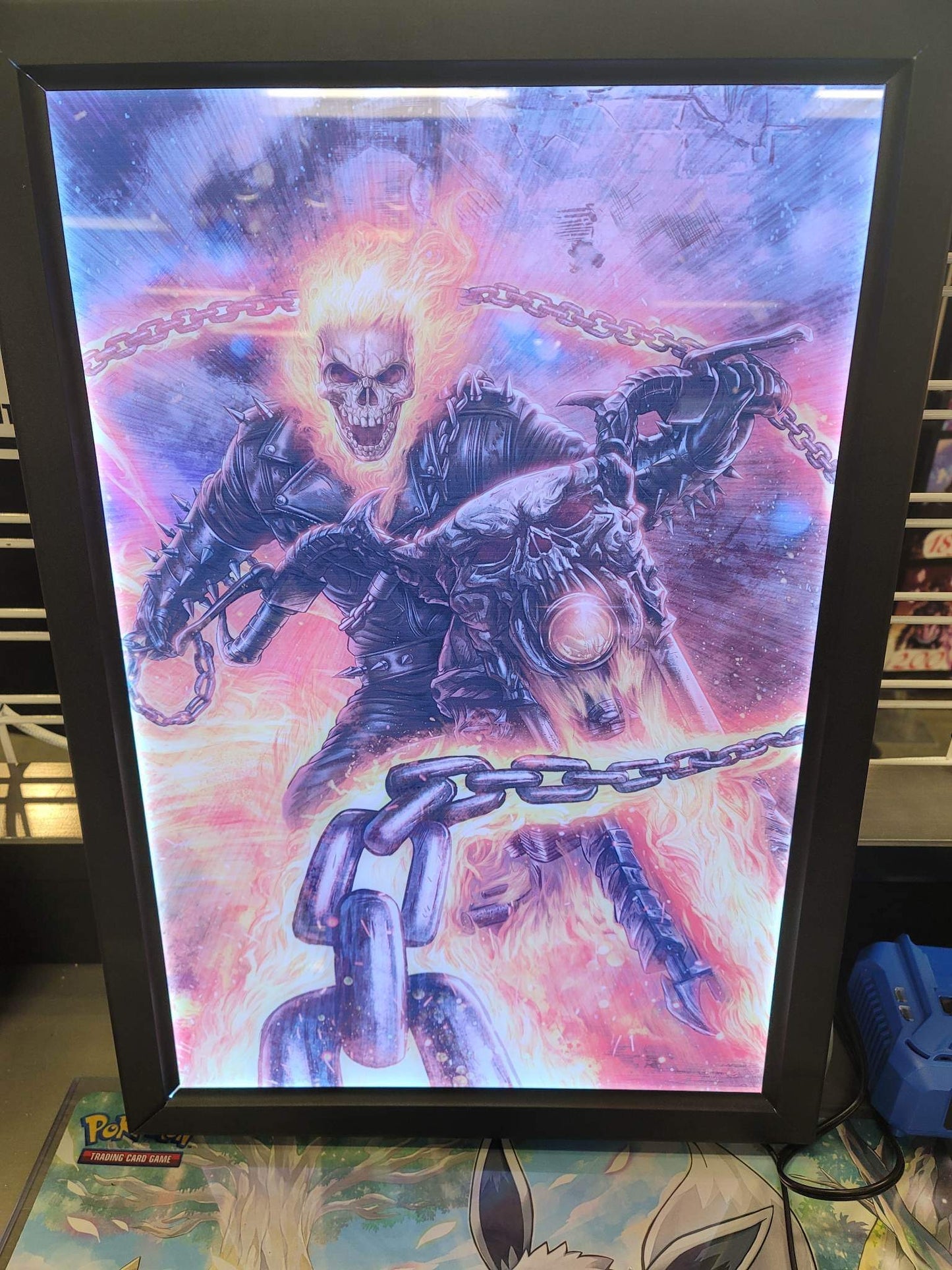 Ghost Rider comic art displayed in RGB LED acrylic lightbox frame with bright white backlighting, perfect for collectors and fans, Snapping Turtle Gallery.