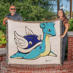 Cozy throw blanket draped over a couch featuring vibrant fan-art design from Snapping Turtle Gallery’s Throw Blanket Artwork Collection.