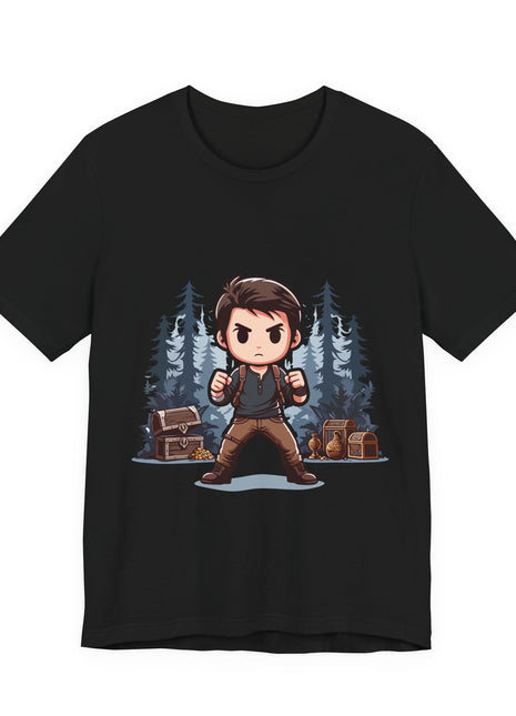 Front of a black graphic T-shirt showing an Uncharted-style chibi explorer holding backpack straps between travel chests and blue-gray conifer trees.
