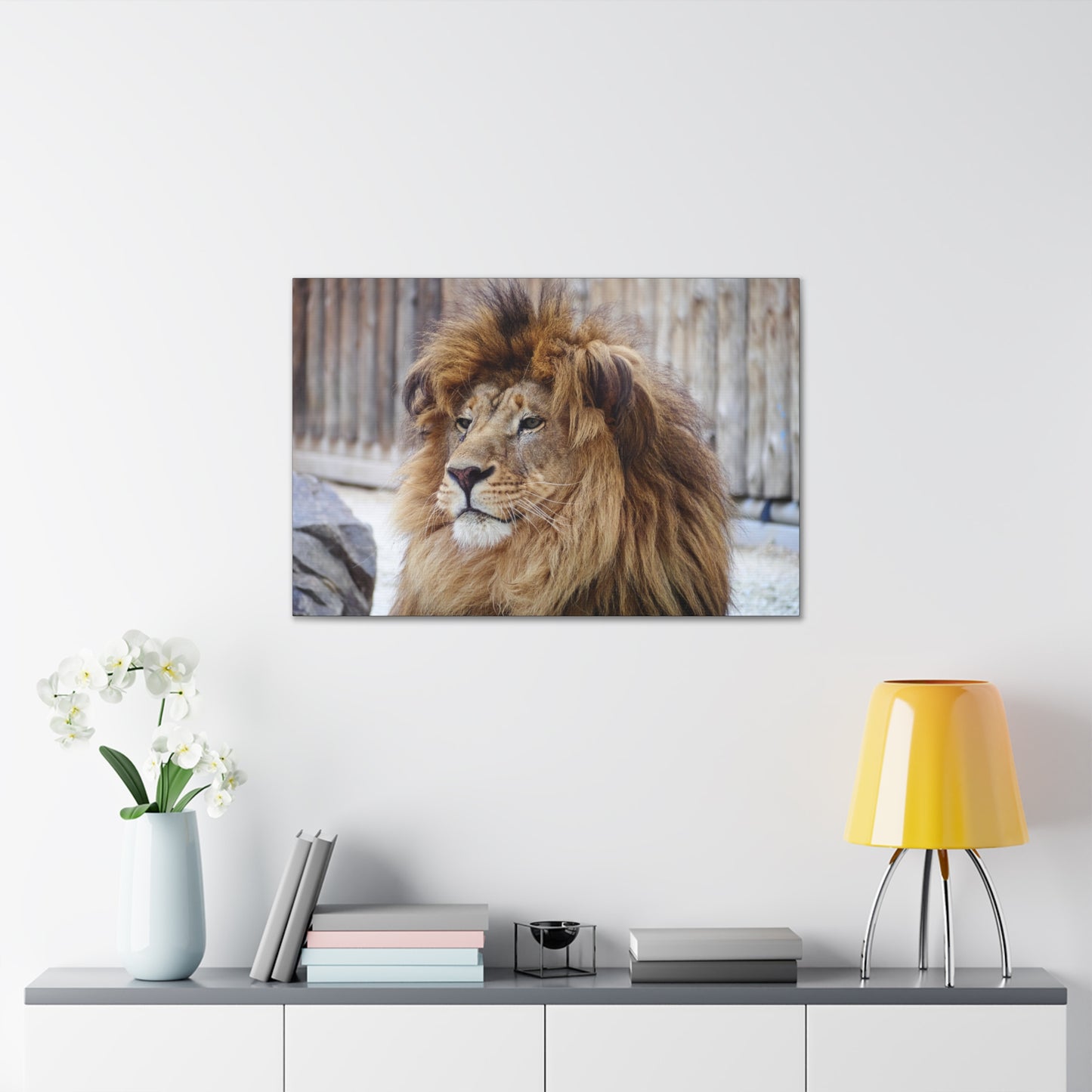 "Regal Rest – Lion Propping His Head Up Wall Art on canvas, acrylic, and metal – front view featuring a calm yet dominant lion resting his head on his paws."
