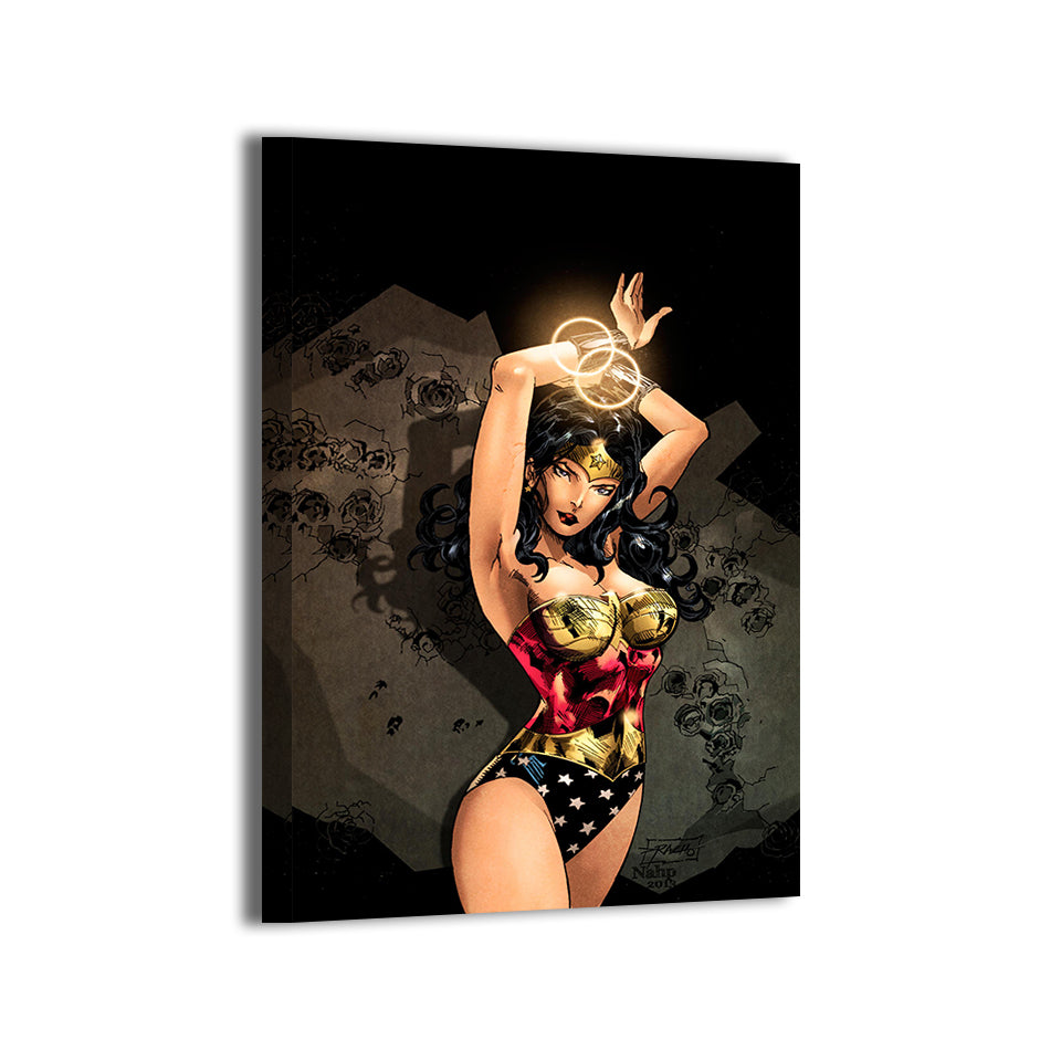 Amazon Radiance Canvas Print — classic Wonder Woman pose with tiara and golden bracers, artwork by Ray Racho with colors by Stephan “NAHP” Lemineur; gallery-wrapped, ready to hang.