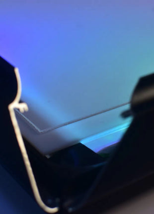 Close-up of the 4-sided snap-close hinge system with RGB LED edge lighting for easy artwork swaps, Snapping Turtle Gallery.