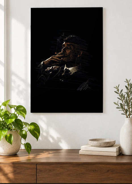 A Thought in Amber acrylic wall art displayed above a wooden console with plants and books against a white wall.