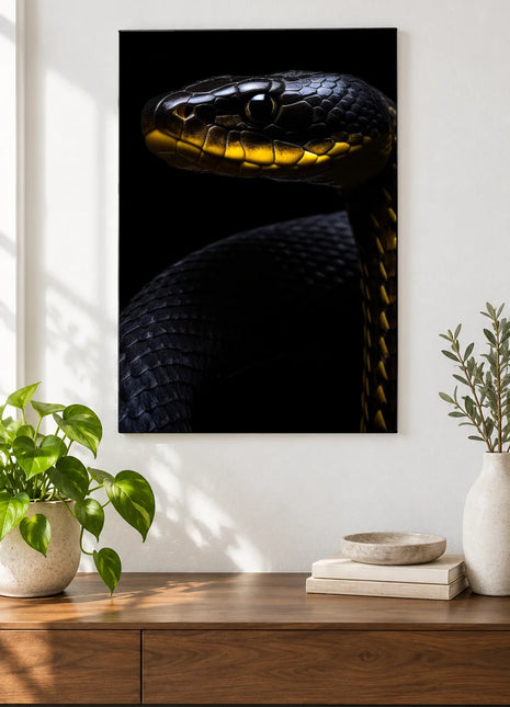 Snake artwork "Black Tie, Gold Collar" shown as a frameless acrylic print above a walnut console against a white wall.