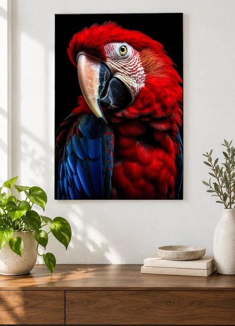Blue-Winged Scarlet Parrot Wall Art, shown as frameless acrylic artwork above a walnut console against a white wall.