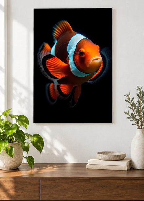 Hello, Little Clown (Clownfish), shown as frameless acrylic artwork above a walnut console against a white wall.