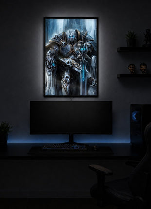 Arthas the Lich King seated on an icy throne with silver hair and a glowing blue rune sword, illuminated in a slim black acrylic LED lightbox above a monitor in a dark game room.