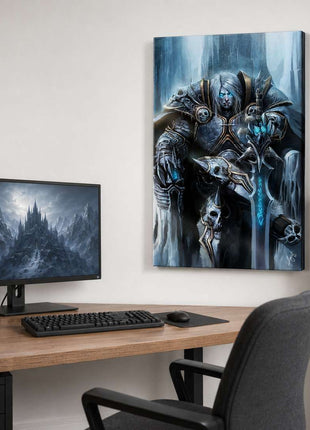 Arthas the Lich King seated on an icy throne with silver hair and a glowing blue rune sword on canvas wall art beside a computer monitor in a game room with white walls.