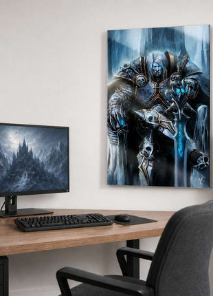 Arthas the Lich King seated on an icy throne with silver hair and a glowing blue rune sword on metal wall art beside a computer monitor in a game room with white walls.