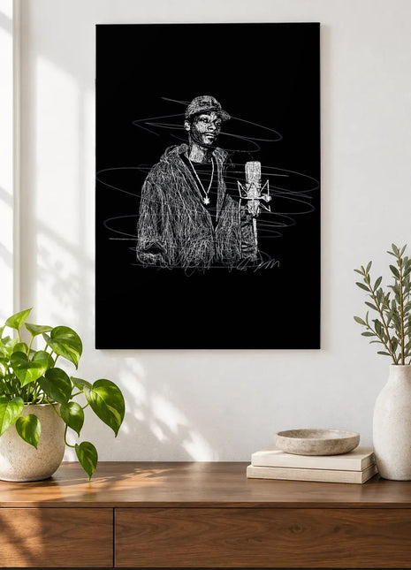 At the Studio Microphone acrylic wall art displayed above a wooden console with plants and books against a white wall.