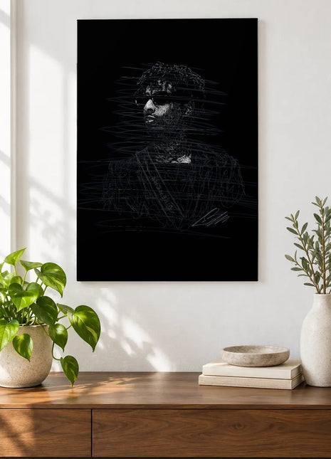 Behind the Dark Lenses acrylic wall art displayed above a wooden console with plants and books against a white wall.
