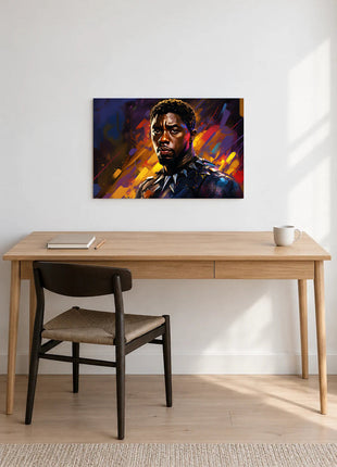 Black Panther Crown of Color acrylic wall art displayed above a wooden desk with a notebook, pencil and white mug against a white wall.