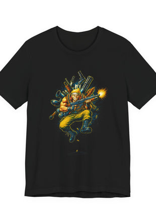 Front of a black T-shirt showing an airborne blond commando firing a gun with a large arsenal behind him.
