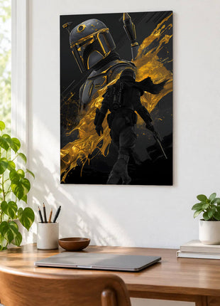 Boba Fett Gold in the Shadows acrylic wall art displayed above a wooden desk with a laptop, plants and books against a white wall.