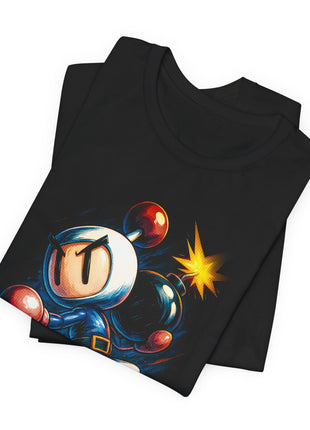 Folded black T-shirt detail showing Bomberman’s white helmet, red antenna ball and the bomb’s yellow fuse spark.