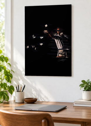 Cash in Midair acrylic wall art displayed above a wooden desk with a laptop, plants and books against a white wall.