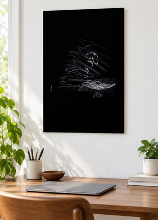 Chain Above an Open Palm acrylic wall art displayed above a wooden desk with a laptop, plants and books against a white wall.