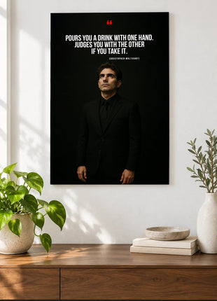 Christopher Moltisanti Double Standards acrylic wall art displayed above a wooden console with plants and books against a white wall.