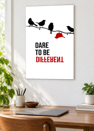 Dare to Be Different acrylic wall art displayed above a wooden desk with a laptop, plants and books against a white wall.