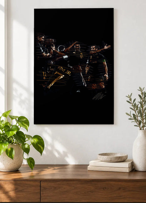 Dark Kits, Shared Celebration acrylic wall art displayed above a wooden console with plants and books against a white wall.