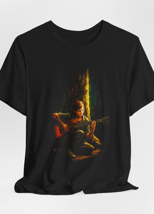 Draped black T-shirt with gathered hem showing Ellie seated beneath a tree playing a brown acoustic guitar in warm golden light.