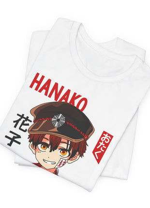 Folded white Hanako-kun T-shirt showing the cap and red lettering.