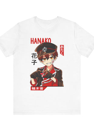 Front detail of a white Hanako-kun T-shirt with a smiling portrait, peaked cap and heart gesture.