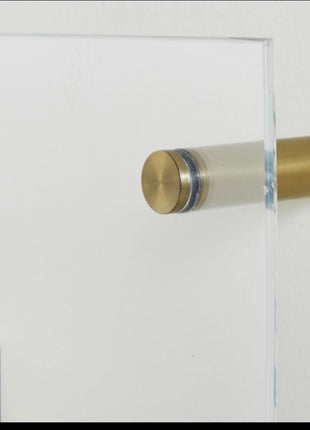 Close-up of front mount peg supporting an acrylic panel away from the wall