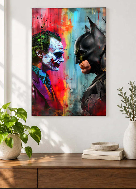 Joker and Batman facing each other in profile across red and blue paint streaks displayed above a console table in a room setting