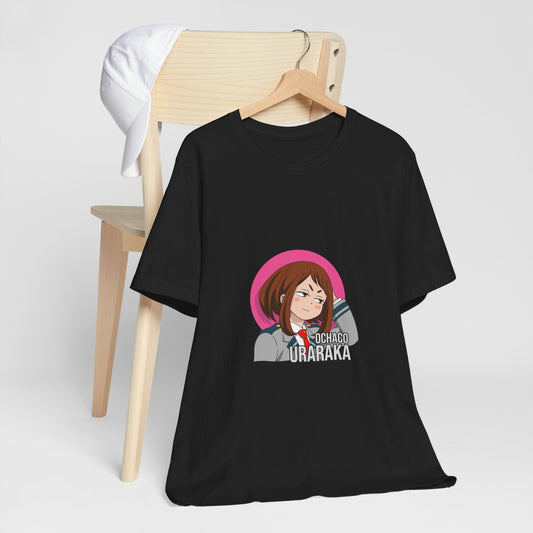 Alt: Gravity Hero Academy Anime Shirt on black, hanging on chair with cap, lifestyle display by Snapping Turtle Gallery

