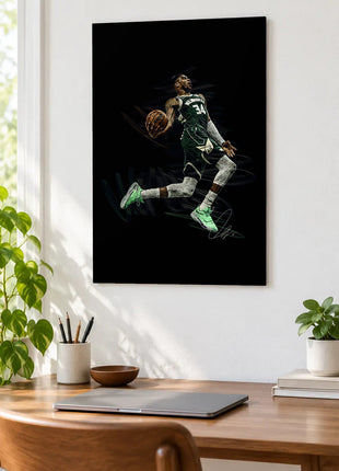 Green Jersey Flight acrylic wall art displayed above a wooden desk with a laptop, plants and books against a white wall.