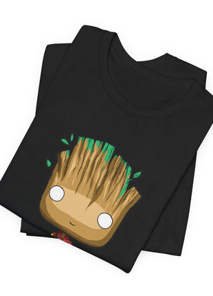 Folded black Groot graphic T-shirt showing a closer view of the chibi red jumpsuit design.