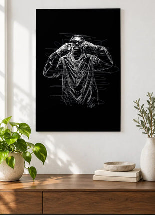 Hands to the Temples acrylic wall art displayed above a wooden console with plants and books against a white wall.