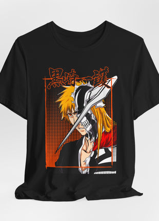 Draped front view of the black Ichigo Split Mask Orange Panel Graphic T-Shirt. Artwork: Ichigo in a split face-and-mask portrait crossed by a diagonal blade over orange halftone dots.