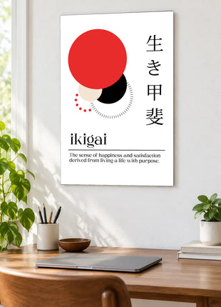 Ikigai in Balance acrylic wall art displayed above a wooden desk with a laptop, plants and books against a white wall.