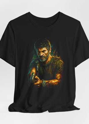 Draped black T-shirt with gathered hem showing Joel holding a pistol in both hands, wearing an olive shirt, backpack straps and a shoulder flashlight.