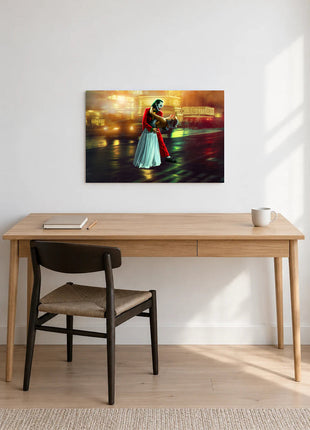 Joker Last Dance in the Rain acrylic wall art displayed above a wooden desk with a notebook, pencil and white mug against a white wall.