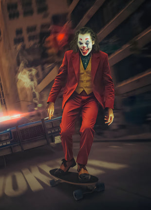 Joker Wheels of Mischief original artwork: shows Joker balancing on a skateboard in a city street with a police car behind him.