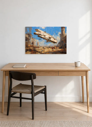 Millennium Falcon Dustbound Arrival acrylic wall art displayed above a wooden desk with a notebook, pencil and white mug against a white wall.