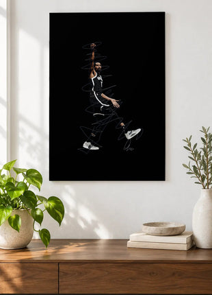 One Arm Above the Game acrylic wall art displayed above a wooden console with plants and books against a white wall.