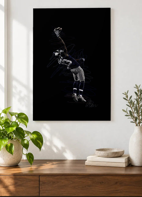 One-Handed Reach acrylic wall art displayed above a wooden console with plants and books against a white wall.