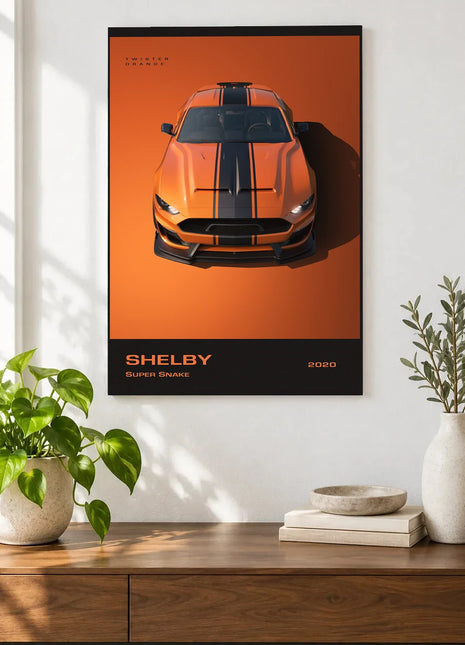 Orange Overdrive wall art displayed as a frameless piece above a wooden console against a light wall