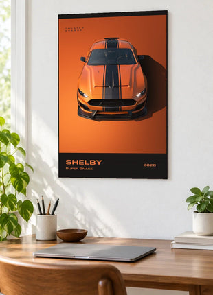 Orange Overdrive wall art displayed as a frameless piece above a wooden desk in a bright room