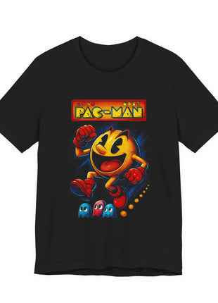 Black T-shirt front showing smiling Pac-Man running above cyan and pink ghosts beneath a Pac-Man heading.