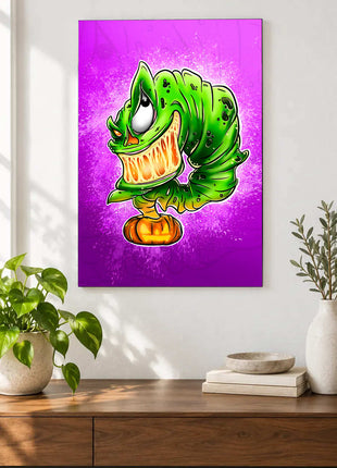 Green toothy cartoon monster above a jack-o'-lantern on purple and magenta displayed above a console table in a room setting