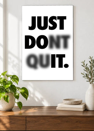 Read Through the Doubt acrylic wall art displayed above a wooden console with plants and books against a white wall.