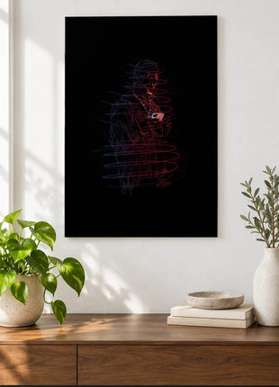 Red and Blue Under the Brim acrylic wall art displayed above a wooden console with plants and books against a white wall.