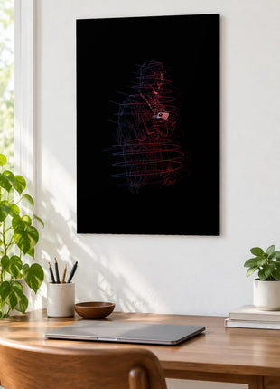 Red and Blue Under the Brim acrylic wall art displayed above a wooden desk with a laptop, plants and books against a white wall.