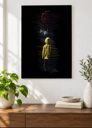 Red Balloon Above the Raincoat acrylic wall art displayed above a wooden console with plants and books against a white wall.