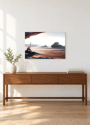 Rey Beyond the Wreckage acrylic wall art displayed above a wooden console with a leafy vase and stacked books against a white wall.